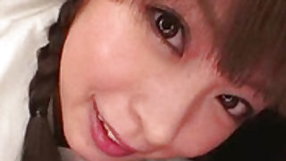 Pigtailed and pretty japanese pornstar is swallowing huge cock